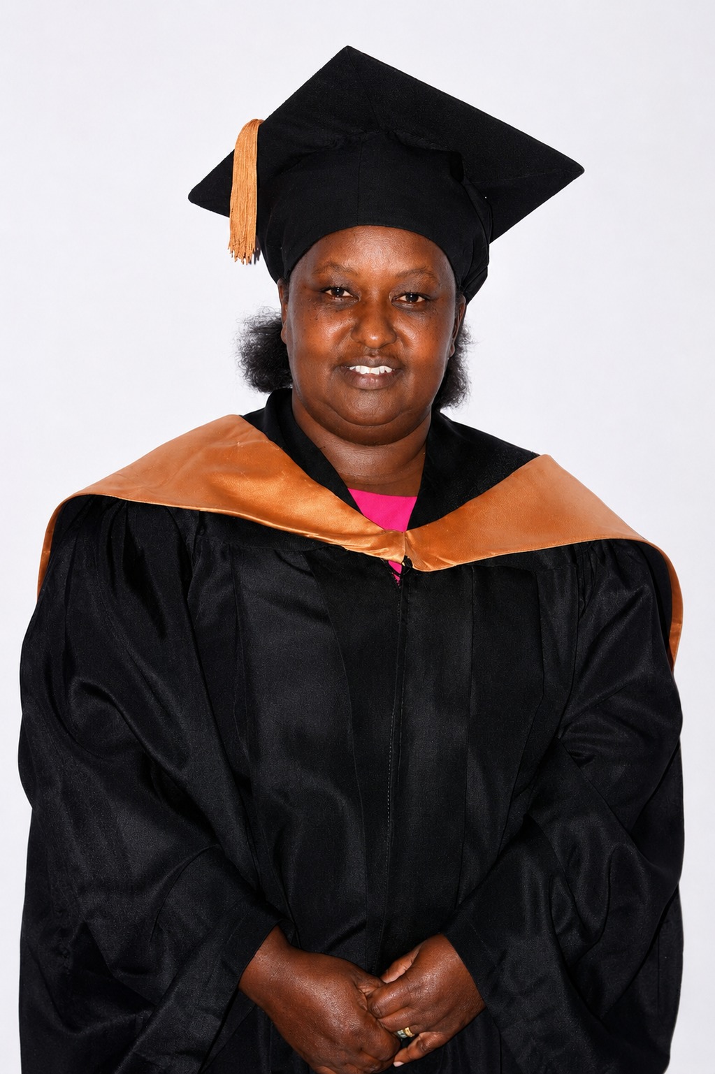 Petronilla Wambui Kishare, Registered Counsellor, in graduation robes.